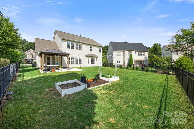 12312 Mcallister Park Dr, Charlotte, NC 28277 - back of house with a gazebo, a patio area, a vegetable garden, and an outdoor living space