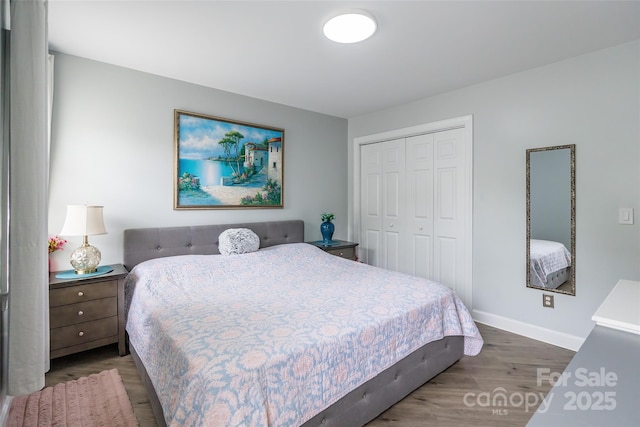 5623 Fetzer Ave NW, Concord, NC 28027 - bedroom featuring wood finished floors and a closet