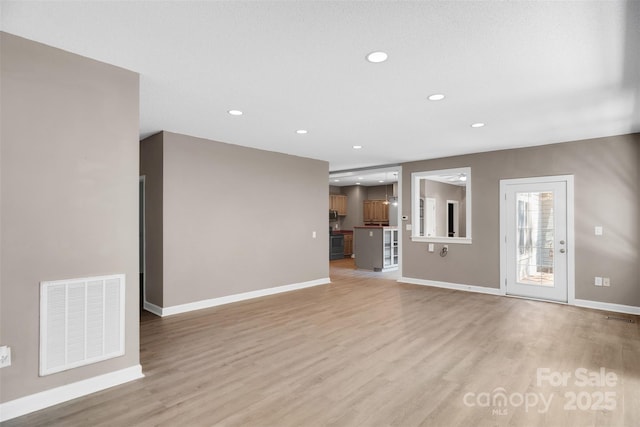 3333 Roberta Rd, Concord, NC 28027 - unfurnished living room featuring light wood finished floors and recessed lighting