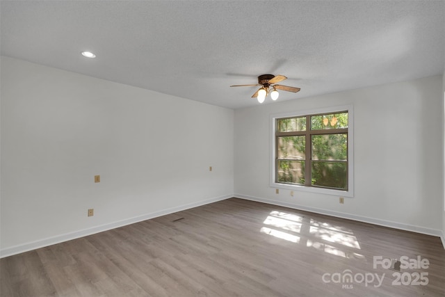3333 Roberta Rd, Concord, NC 28027 - unfurnished room with a ceiling fan, wood finished floors, recessed lighting, and a textured ceiling