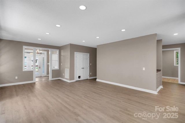 3333 Roberta Rd, Concord, NC 28027 - unfurnished room featuring light wood-type flooring, a chandelier, and recessed lighting