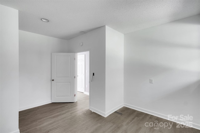 3333 Roberta Rd, Concord, NC 28027 - spare room with wood finished floors and a textured ceiling