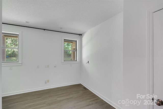 3333 Roberta Rd, Concord, NC 28027 - spare room featuring a textured ceiling, plenty of natural light, and wood finished floors