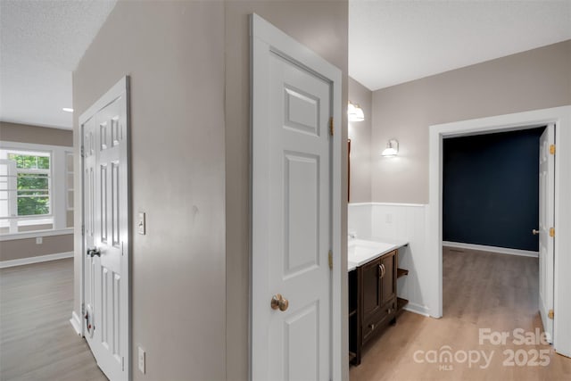 3333 Roberta Rd, Concord, NC 28027 - hall featuring light wood-style flooring and a textured ceiling