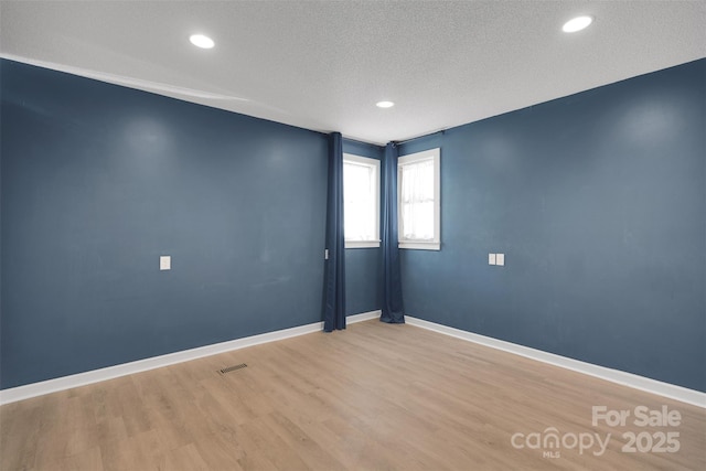 3333 Roberta Rd, Concord, NC 28027 - spare room with light wood finished floors, a textured ceiling, and recessed lighting