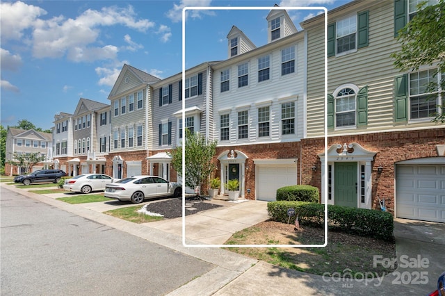 2945 Duvalla Ave, Charlotte, NC 28209 - multi unit property featuring a residential view, brick siding, driveway, and an attached garage