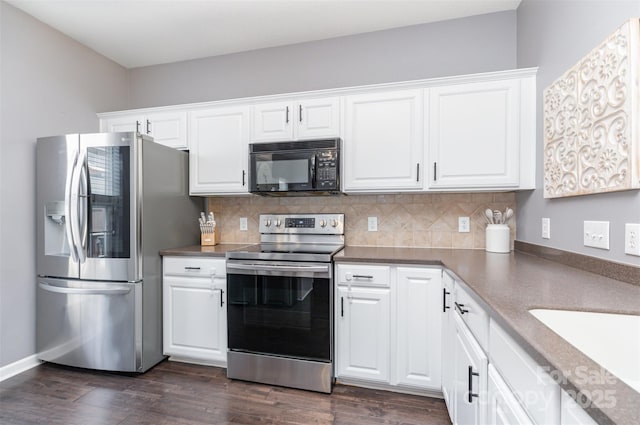 2945 Duvalla Ave, Charlotte, NC 28209 - kitchen with appliances with stainless steel finishes, dark wood-type flooring, tasteful backsplash, and white cabinets