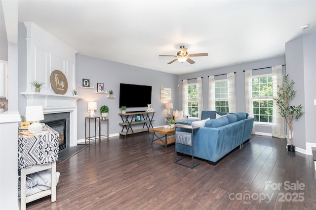 2945 Duvalla Ave, Charlotte, NC 28209 - living area featuring a ceiling fan, a glass covered fireplace, and wood finished floors