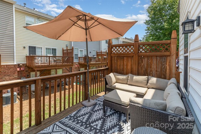 2945 Duvalla Ave, Charlotte, NC 28209 - wooden deck featuring outdoor lounge area