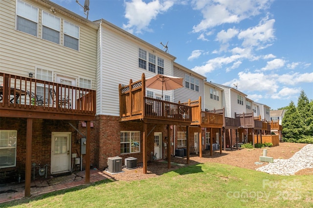 2945 Duvalla Ave, Charlotte, NC 28209 - back of house featuring a yard, a wooden deck, and brick siding