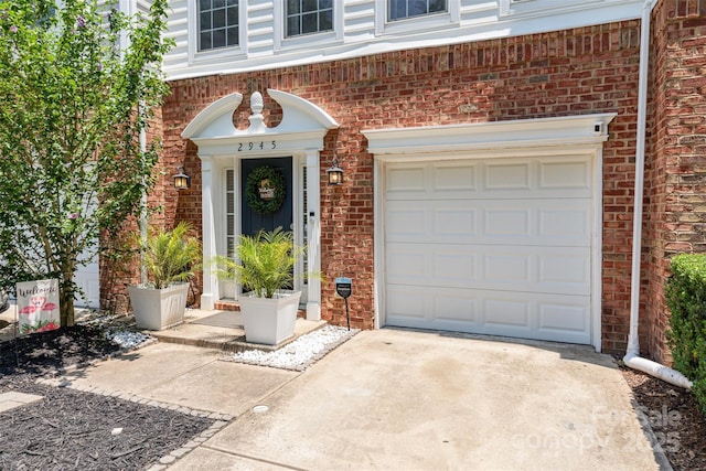 2945 Duvalla Ave, Charlotte, NC 28209 - entrance to property with driveway, brick siding, and an attached garage
