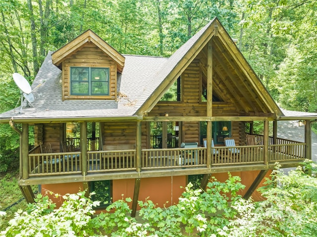 536 Tawodi Trl, Maggie Valley, NC 28751 - cabin featuring log exterior, a shingled roof, and a view of trees