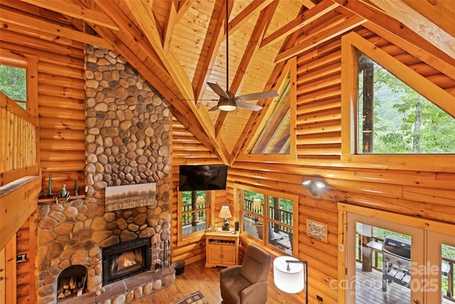 536 Tawodi Trl, Maggie Valley, NC 28751 - living area featuring high vaulted ceiling, light wood finished floors, wooden ceiling with exposed beams, log walls, and a fireplace