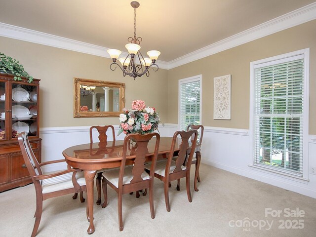 155 Culpeze Rd, Mooresville, NC 28117 - dining space with ornamental molding, light carpet, a chandelier, and a wainscoted wall