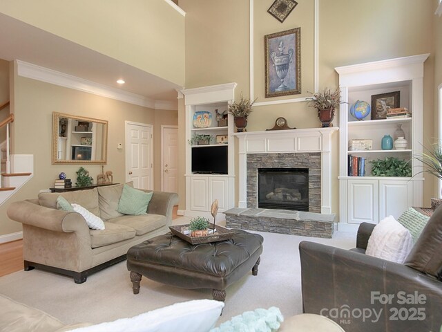 155 Culpeze Rd, Mooresville, NC 28117 - living room with ornamental molding, stairway, a stone fireplace, built in features, and recessed lighting