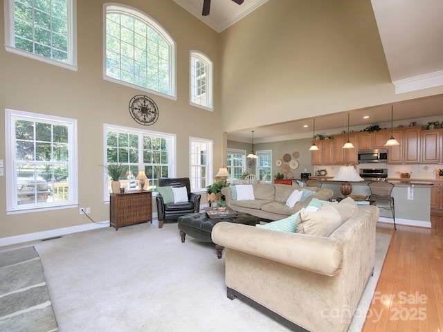 155 Culpeze Rd, Mooresville, NC 28117 - living area featuring crown molding, plenty of natural light, ceiling fan, and a high ceiling