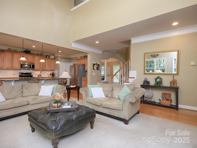 155 Culpeze Rd, Mooresville, NC 28117 - living area featuring ornamental molding, arched walkways, decorative columns, recessed lighting, and stairway