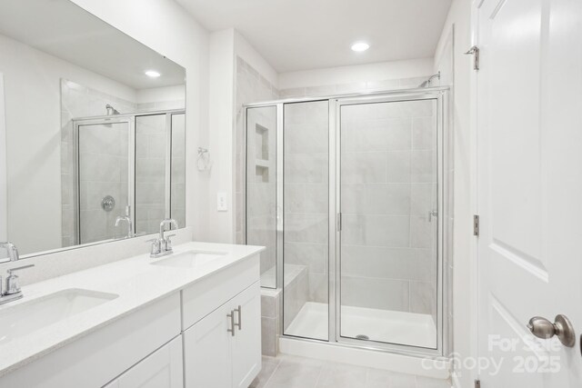 1730 Old Rivers Rd, Concord, NC 28027 - bathroom featuring a shower stall, double vanity, tile patterned flooring, and recessed lighting