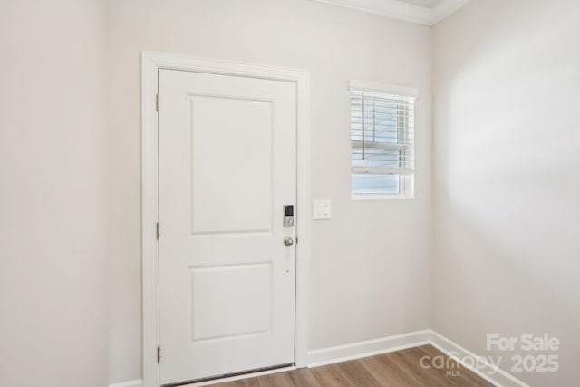 1730 Old Rivers Rd, Concord, NC 28027 - entryway featuring baseboards, wood finished floors, and ornamental molding