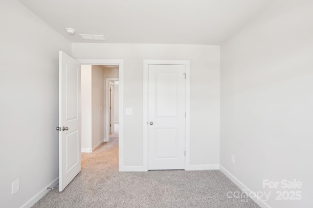 1423 Old Rivers Rd, Concord, NC 28027 - unfurnished bedroom featuring light colored carpet and baseboards