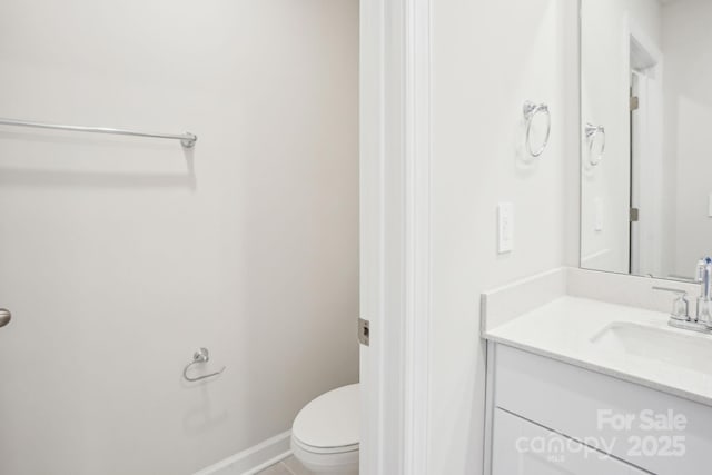 1423 Old Rivers Rd, Concord, NC 28027 - bathroom featuring vanity, toilet, and baseboards