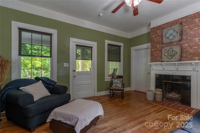6 Wood Ave, Asheville, NC 28803 - living room with ceiling fan, wood finished floors, a fireplace, and baseboards