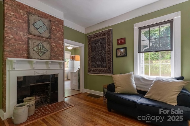 6 Wood Ave, Asheville, NC 28803 - sitting room with hardwood / wood-style flooring, a fireplace, and baseboards