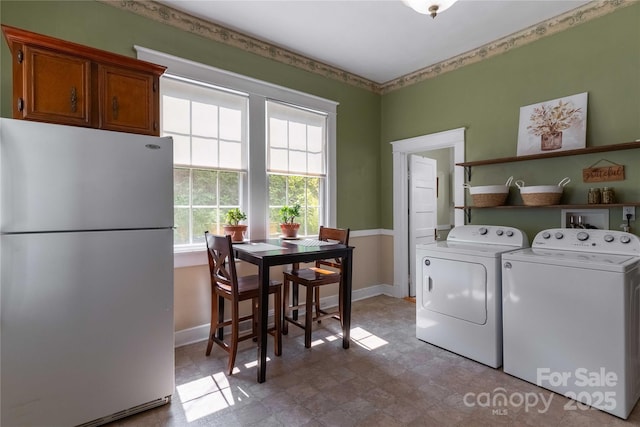 6 Wood Ave, Asheville, NC 28803 - laundry area featuring washer and clothes dryer and baseboards