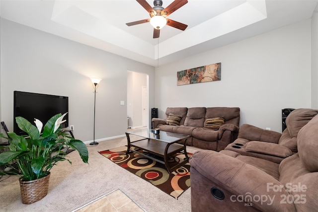 7012 Somerset Springs Dr Unit E, Charlotte, NC 28262 - living room with a ceiling fan, light carpet, and a tray ceiling