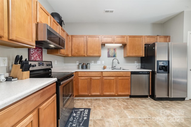 7012 Somerset Springs Dr Unit E, Charlotte, NC 28262 - kitchen with appliances with stainless steel finishes, light countertops, and stone finish flooring