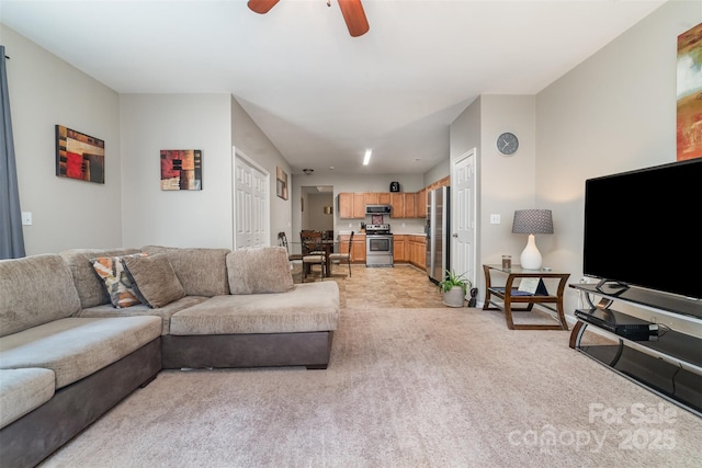 7012 Somerset Springs Dr Unit E, Charlotte, NC 28262 - living room with light colored carpet and a ceiling fan