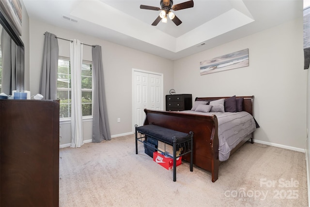 7012 Somerset Springs Dr Unit E, Charlotte, NC 28262 - bedroom with a tray ceiling, carpet, a ceiling fan, and a closet