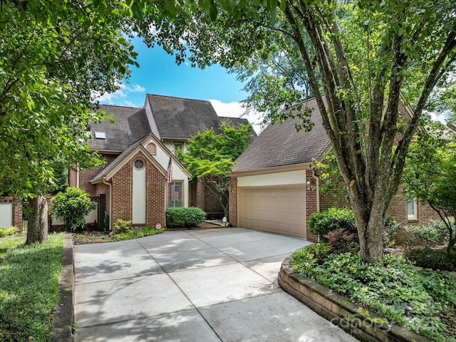 5104 Top Seed Ct, Charlotte, NC 28226 - view of front of house with driveway, brick siding, a shingled roof, and an attached garage