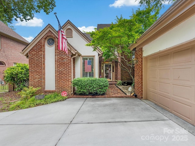 5104 Top Seed Ct, Charlotte, NC 28226 - view of front of home featuring brick siding, stucco siding, and concrete driveway