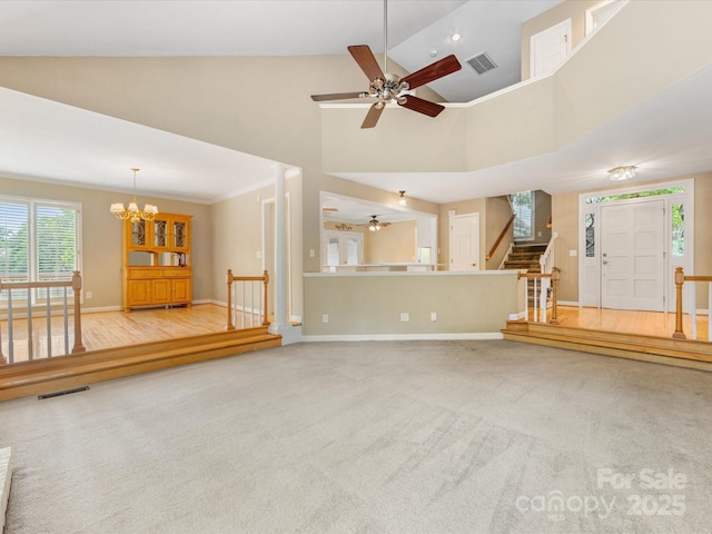 5104 Top Seed Ct, Charlotte, NC 28226 - unfurnished living room featuring ceiling fan, stairway, carpet, high vaulted ceiling, and a chandelier