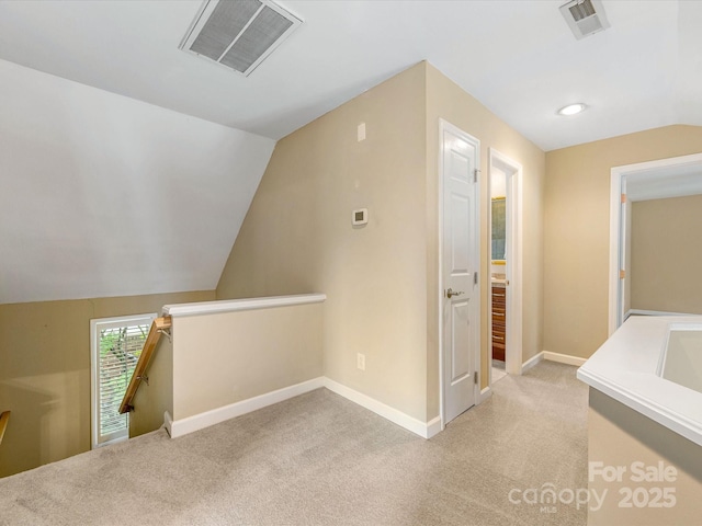 5104 Top Seed Ct, Charlotte, NC 28226 - hall with an upstairs landing, light colored carpet, and lofted ceiling