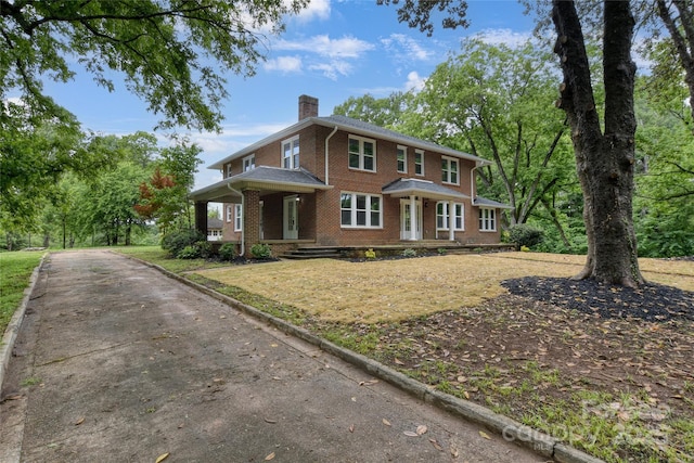 1783 Radio Station Rd, Newton, NC 28658 - view of front of property with brick siding, a chimney, and a porch