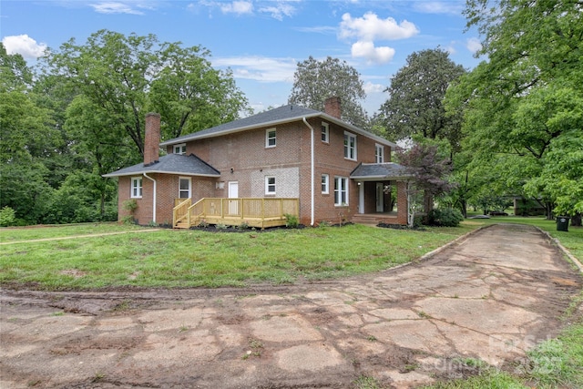 1783 Radio Station Rd, Newton, NC 28658 - view of property exterior with a chimney, brick siding, a lawn, and a wooden deck