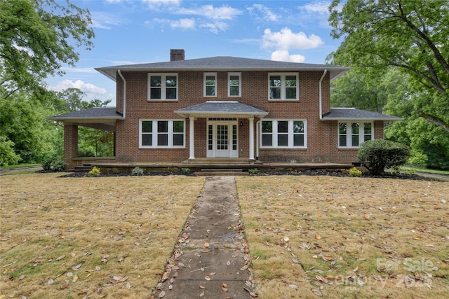 1783 Radio Station Rd, Newton, NC 28658 - view of front of home featuring a chimney, brick siding, and french doors