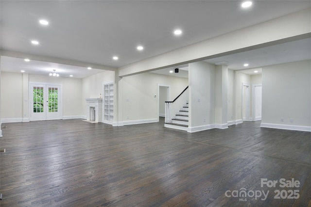 1783 Radio Station Rd, Newton, NC 28658 - unfurnished living room featuring dark wood-type flooring, stairs, baseboards, and recessed lighting