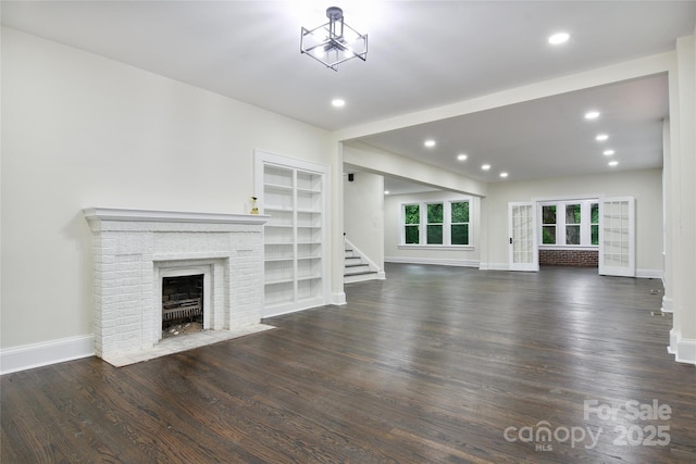 1783 Radio Station Rd, Newton, NC 28658 - unfurnished living room featuring stairway, a fireplace, wood finished floors, baseboards, and recessed lighting
