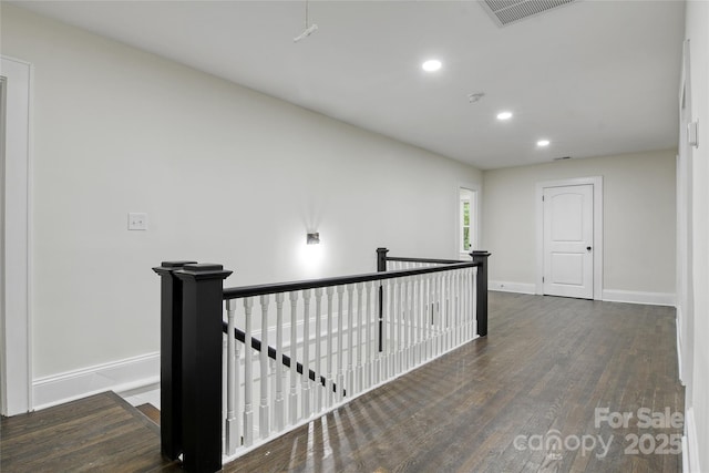 1783 Radio Station Rd, Newton, NC 28658 - hallway with an upstairs landing, wood finished floors, recessed lighting, and baseboards
