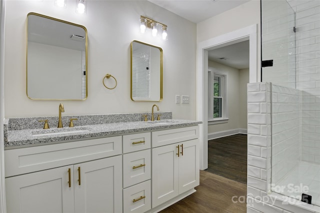 1783 Radio Station Rd, Newton, NC 28658 - full bath with double vanity, wood finished floors, a tile shower, and baseboards
