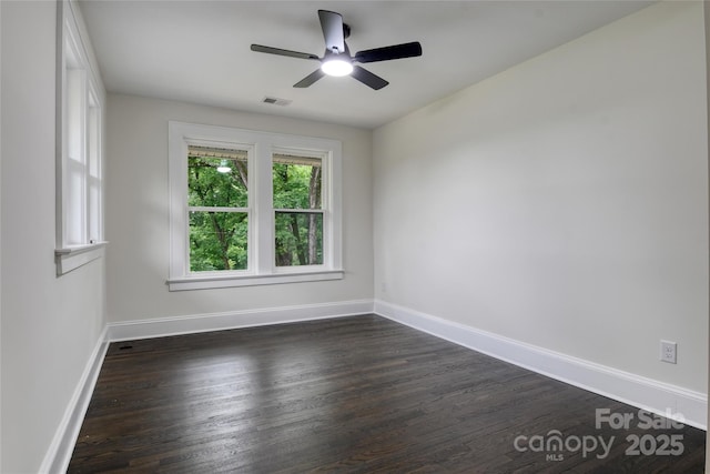 1783 Radio Station Rd, Newton, NC 28658 - spare room featuring dark wood-style flooring, ceiling fan, and baseboards