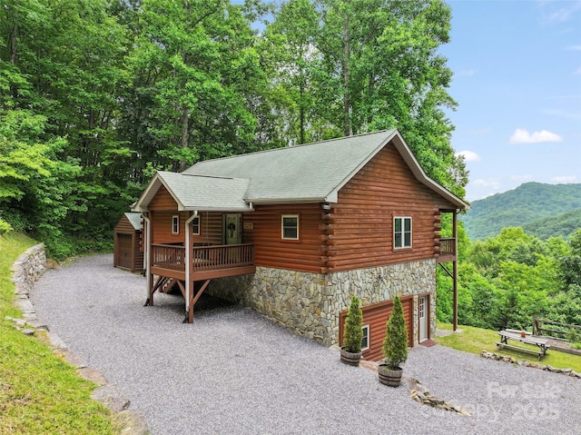 314 Prosperity Rdg, Waynesville, NC 28785 - view of front of home with driveway, stone siding, log exterior, and a mountain view