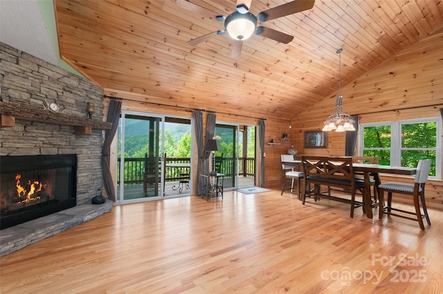 314 Prosperity Rdg, Waynesville, NC 28785 - dining space with a stone fireplace, high vaulted ceiling, wood finished floors, wooden ceiling, and a ceiling fan