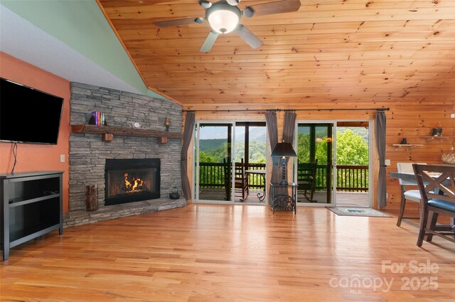 314 Prosperity Rdg, Waynesville, NC 28785 - unfurnished living room featuring vaulted ceiling, wood ceiling, plenty of natural light, a fireplace, and a ceiling fan