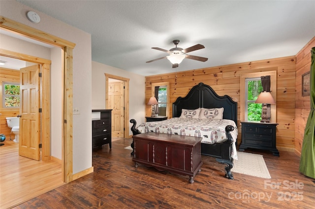 314 Prosperity Rdg, Waynesville, NC 28785 - bedroom featuring wood walls, wood finished floors, baseboards, and a ceiling fan