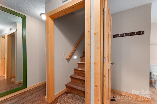 314 Prosperity Rdg, Waynesville, NC 28785 - stairway with a textured ceiling, wood finished floors, and baseboards