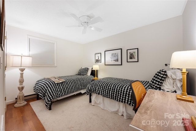 1207 Ridge Rd Unit 25, Glade Valley, NC 28627 - bedroom with wood finished floors, ceiling fan, and baseboards